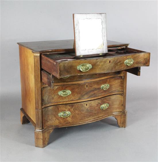 A George III serpentine mahogany dressing chest, W.3ft 7.5in. D.1ft 11.5in. H.2ft 8in.